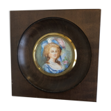 Elegant miniature in blue hat