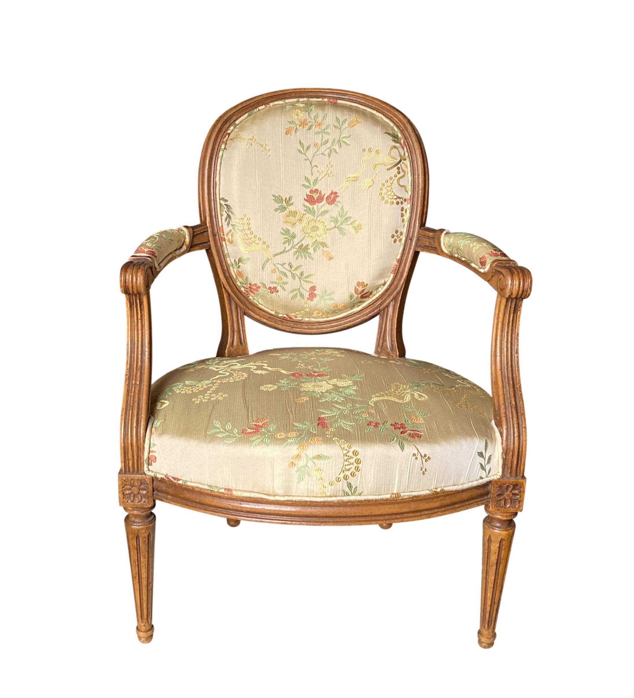 Pair of Louis XVI silk cabriolet armchairs