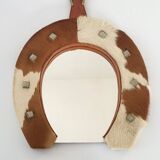 Vintage 1970s cowhide horseshoe mirror
