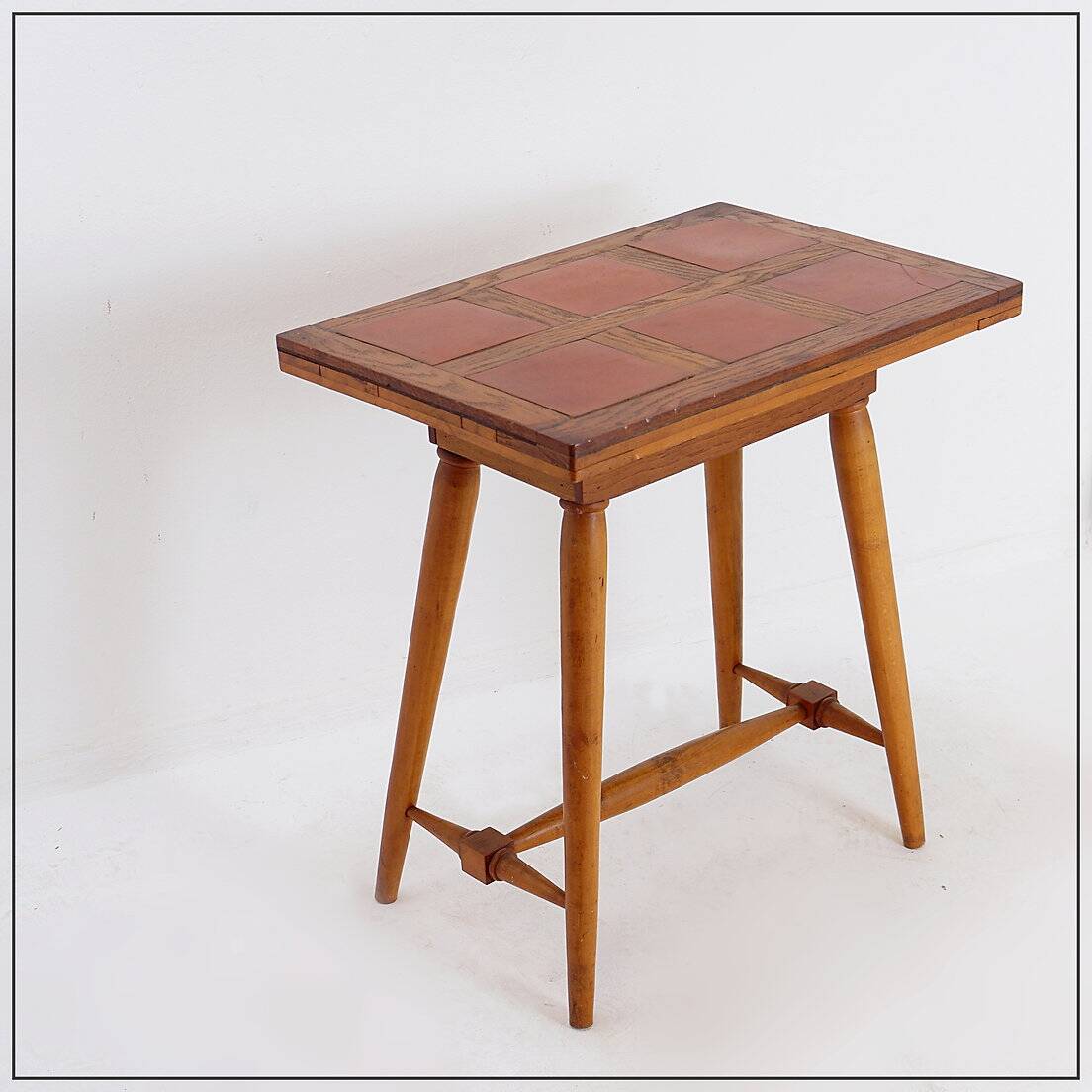 Vintage wooden side table with terracotta top