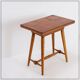 Vintage wooden side table with terracotta top