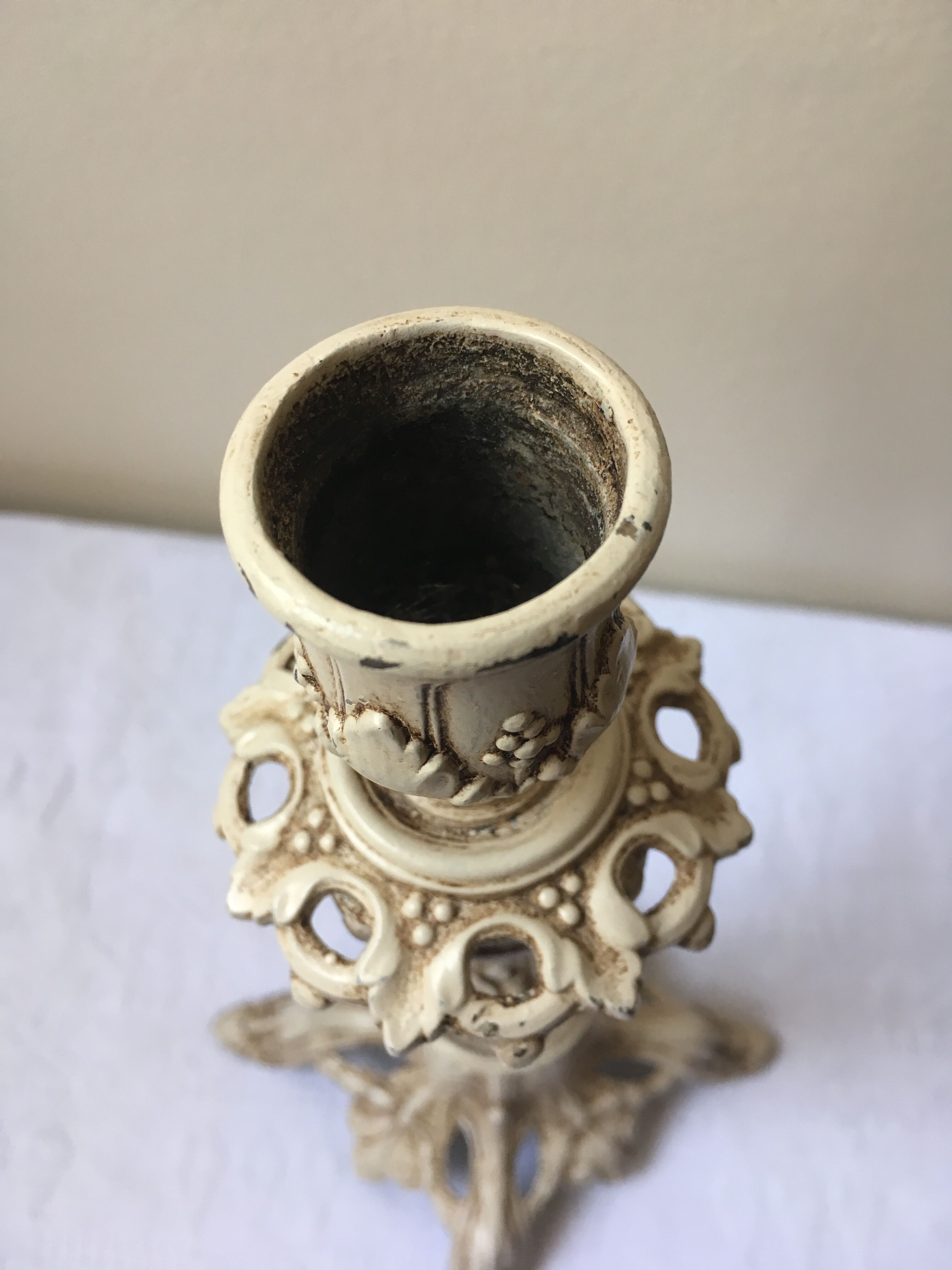 Large candle holder in patinated white painted metal