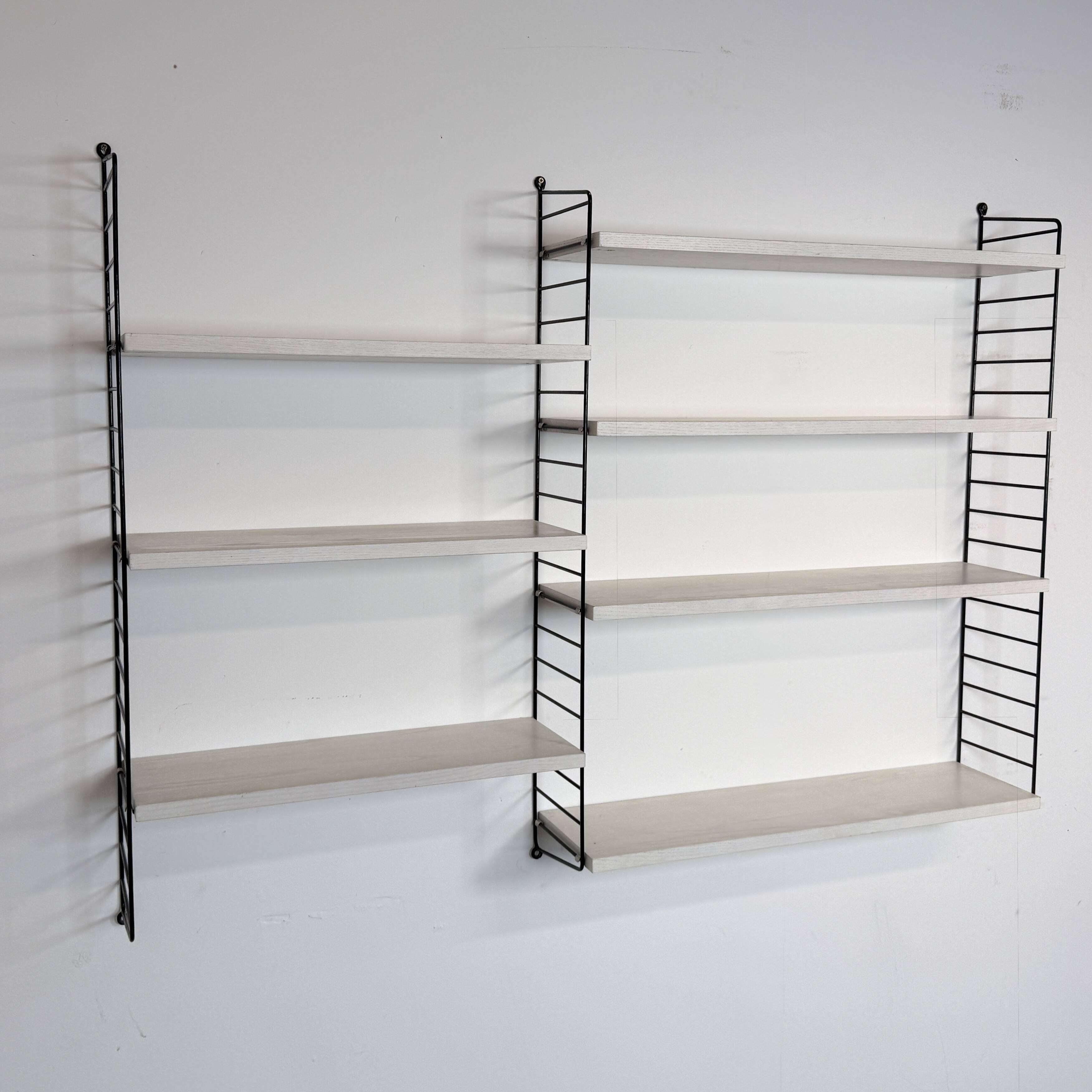 Vintage Nisse Strinning wall rack with 7 white shelves