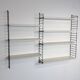 Vintage Nisse Strinning wall rack with 7 white shelves