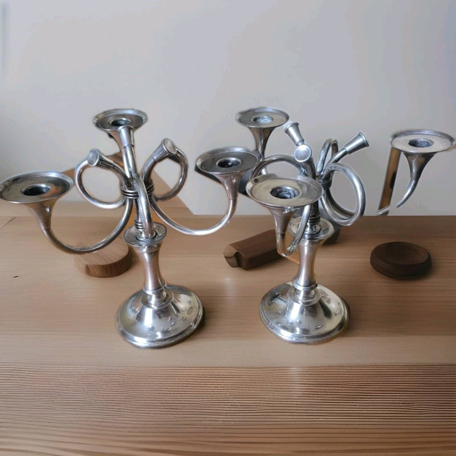 Ercuis pair of candlesticks model Cheverny in silver-plated metal with hunting horn decoration.