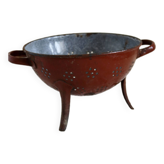 Vintage red enameled colander on feet