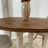 Extendable round table in raw and white wood