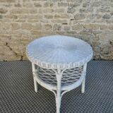 Round white rattan side table with storage underneath, circa 1970.