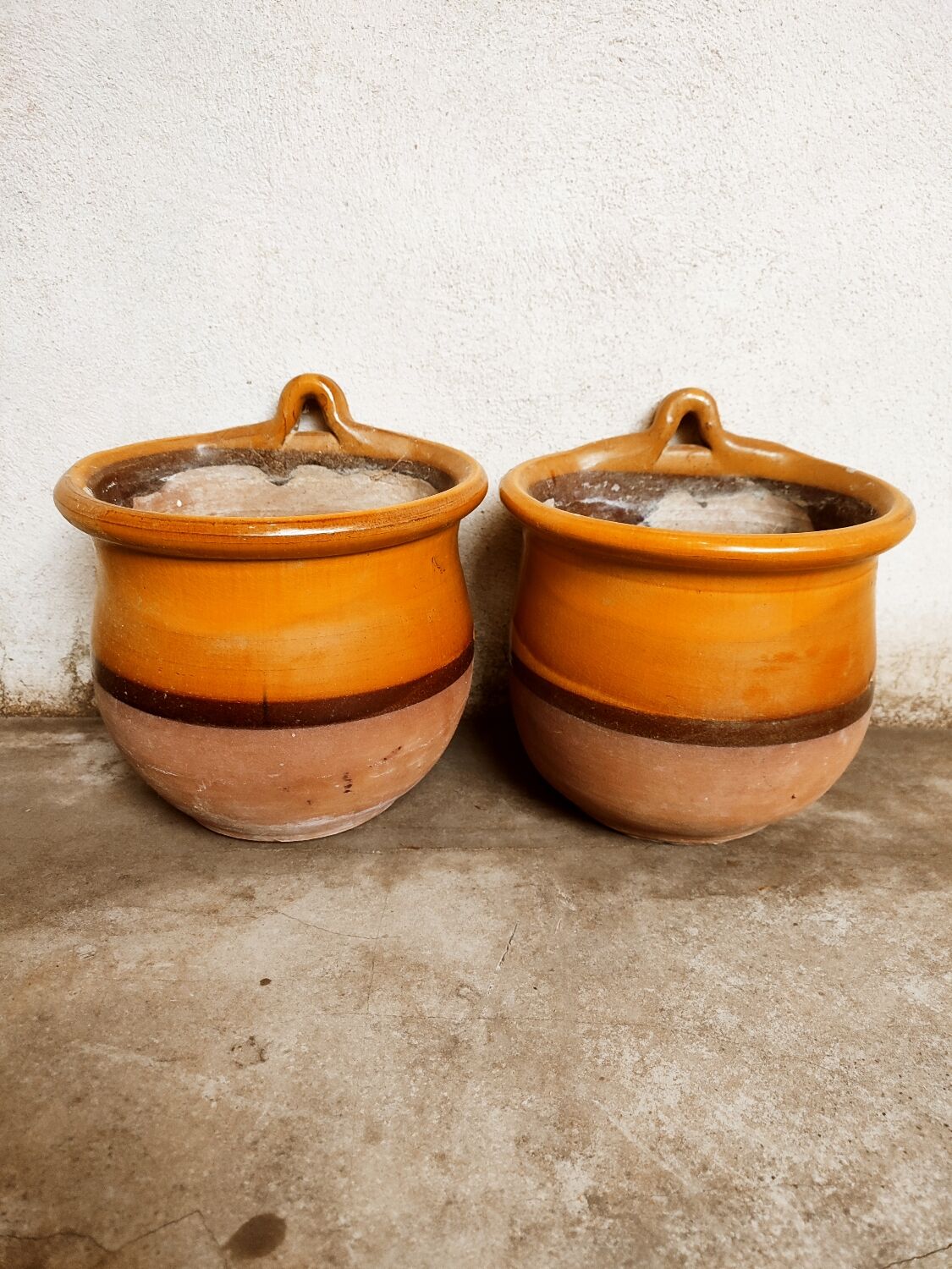 Duo of glazed terracotta pots