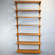 Danish wall shelf by Hansen and Guldborg, teak, aluminum rails, 1960s.