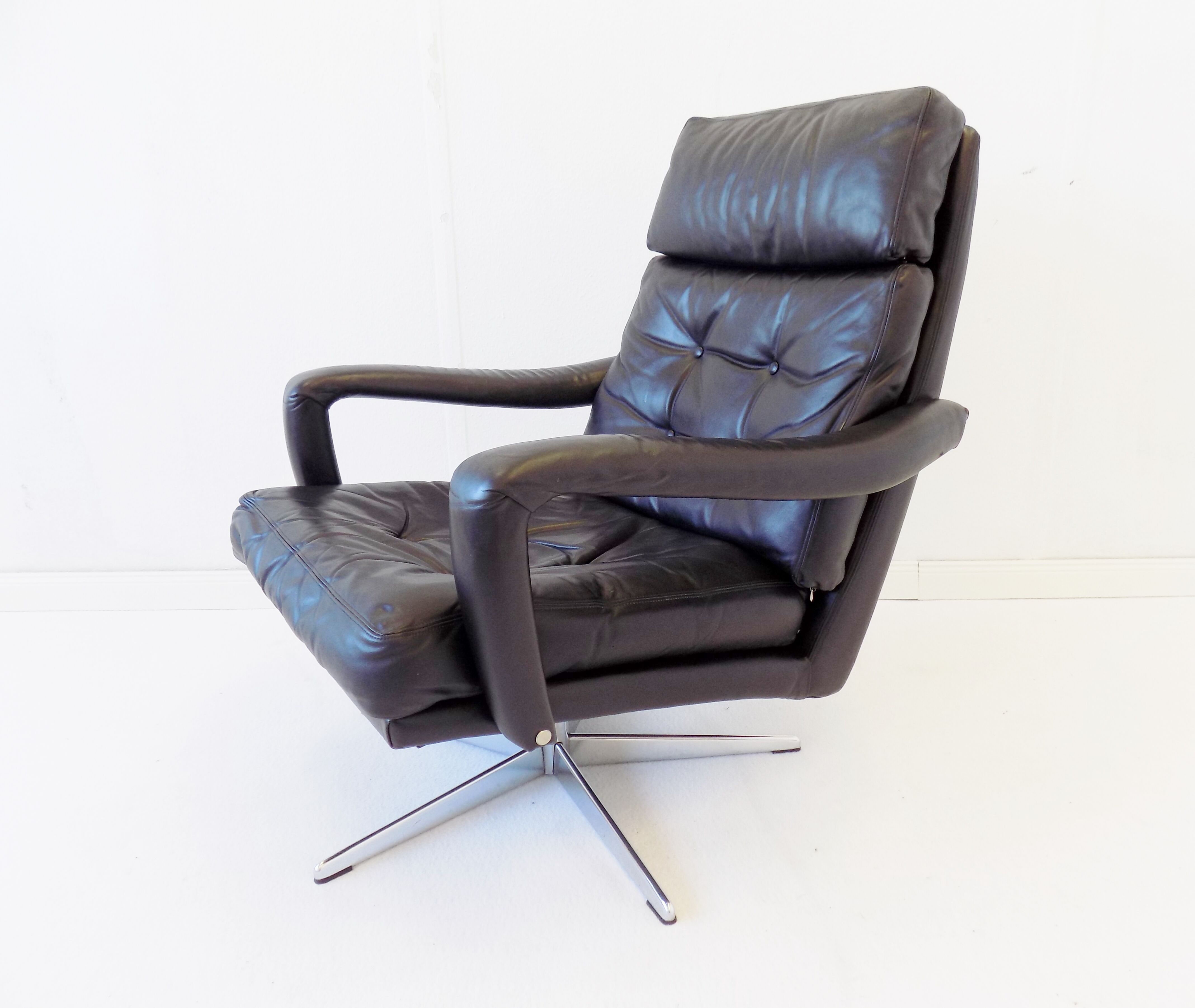 Danish black leather armchair with ottoman 70s