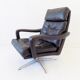 Danish black leather armchair with ottoman 70s