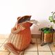 Vintage frog magazine rack in woven wicker design by Olivier Cajan