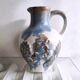 Small ceramic pitcher decorated with grapes