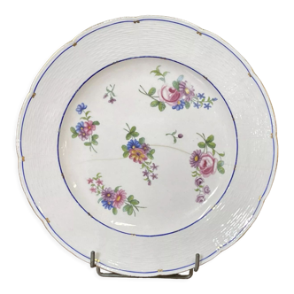 Plate in porcelain of Sèvres with polychrome decoration of flowers of the eighteenth century