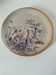 Stoneware plate with hand-painted floral decoration