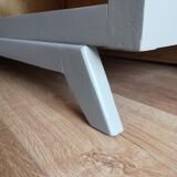 Asymmetrical cabinet compass feet