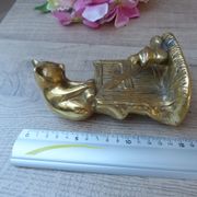 Golden brass cat figurine on fence looking at a mouse in a Vintage India shoe