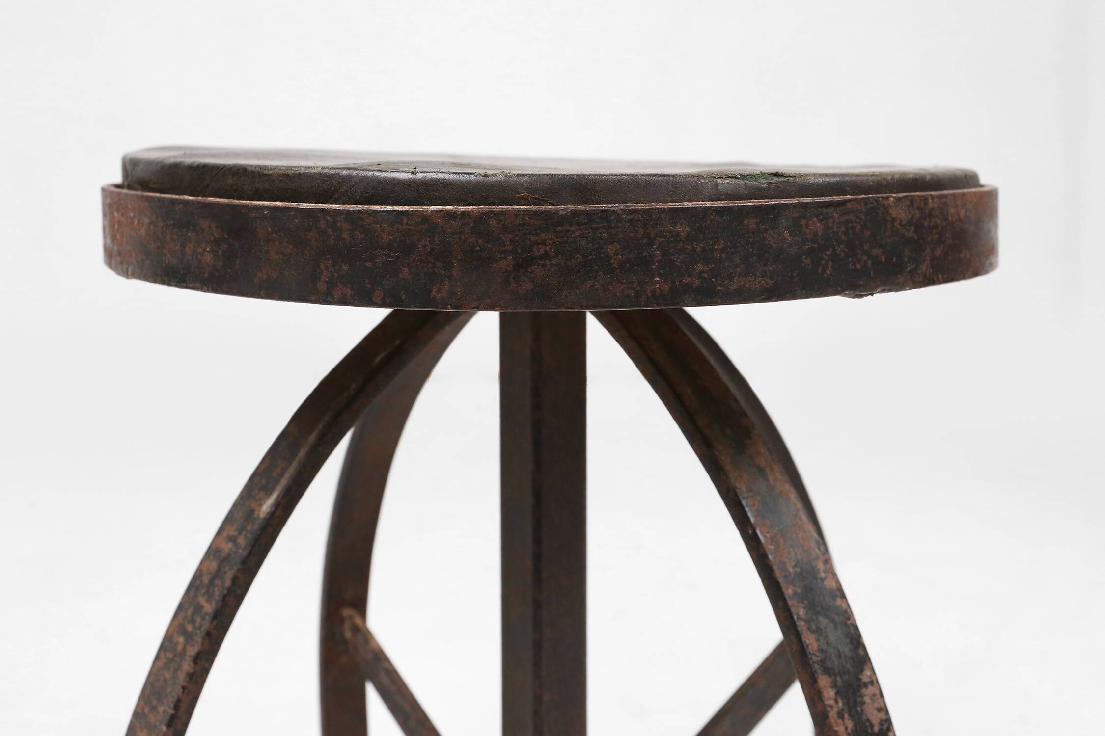 Industrial black metal stool with unique frame, France ca. 1920