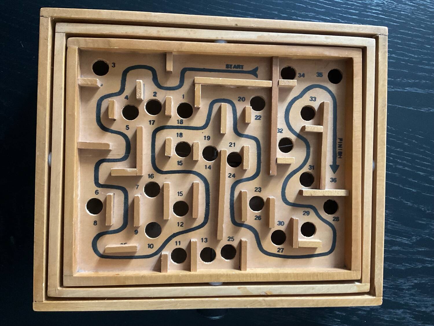 Old wooden maze game