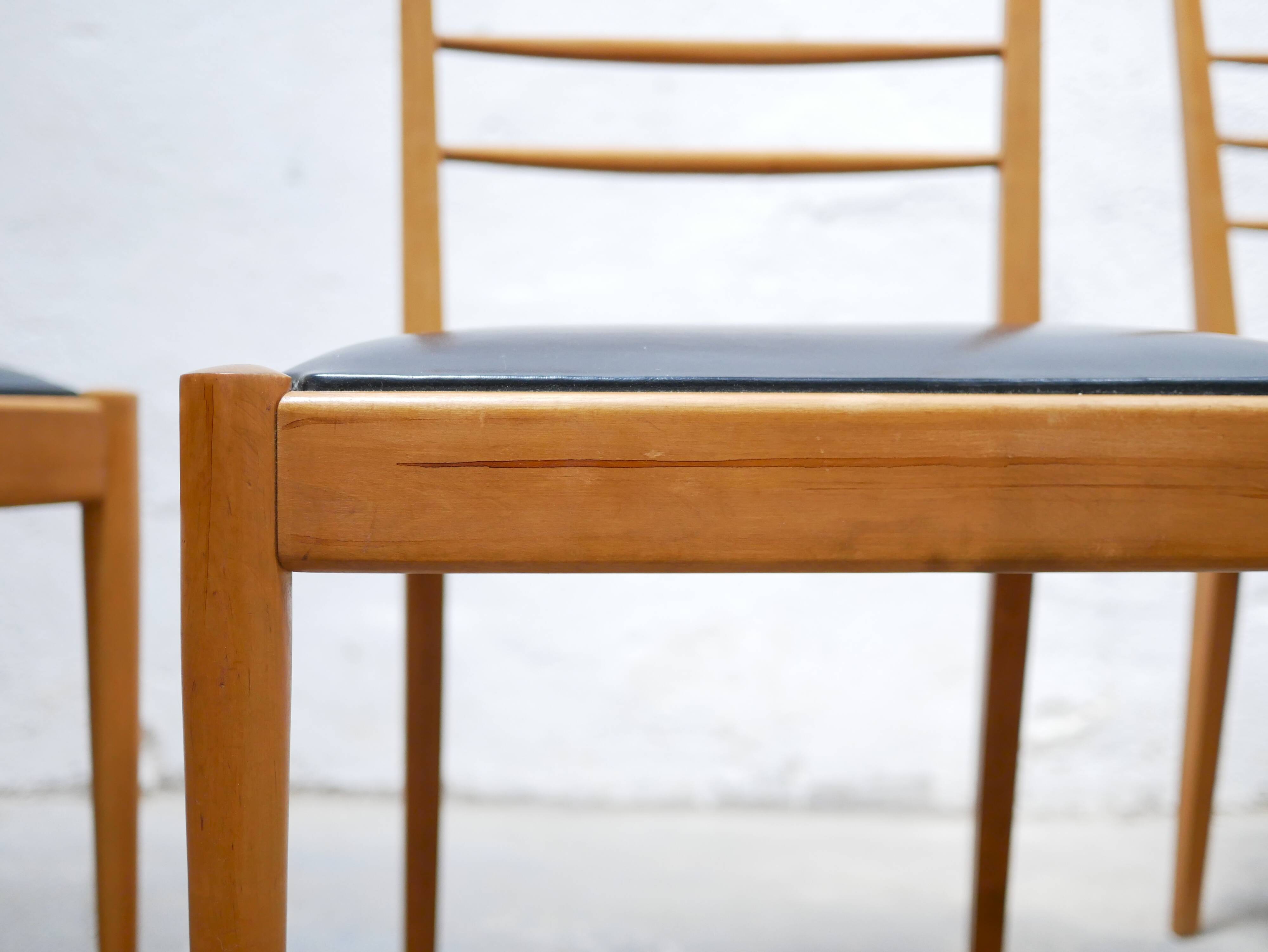 Series of 4 vintage chairs in wood and skaï