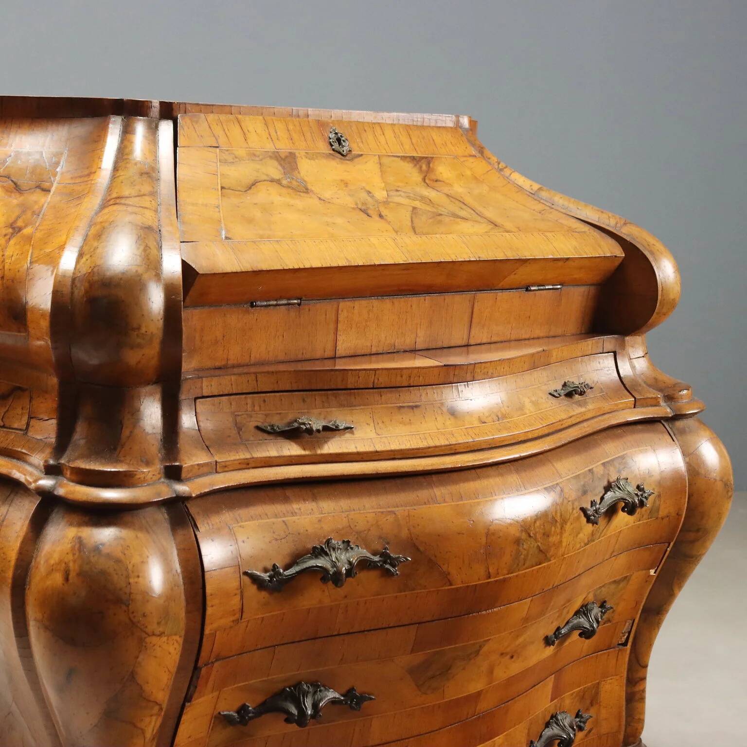Antique drop-leaf secretary in baroque style made of walnut and maple, 20th century.
