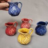 Set of 5 old onnaing barbotine jugs. creamer, sauce boat