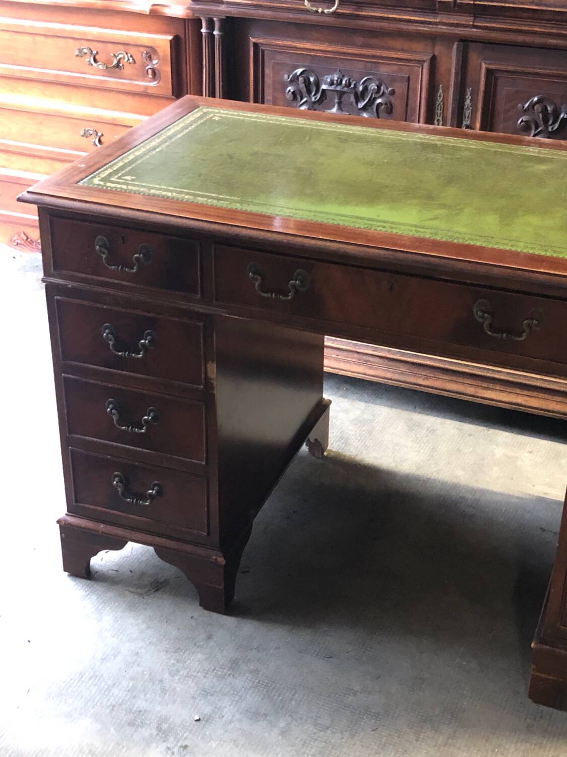 English pedestal desk with green leather top