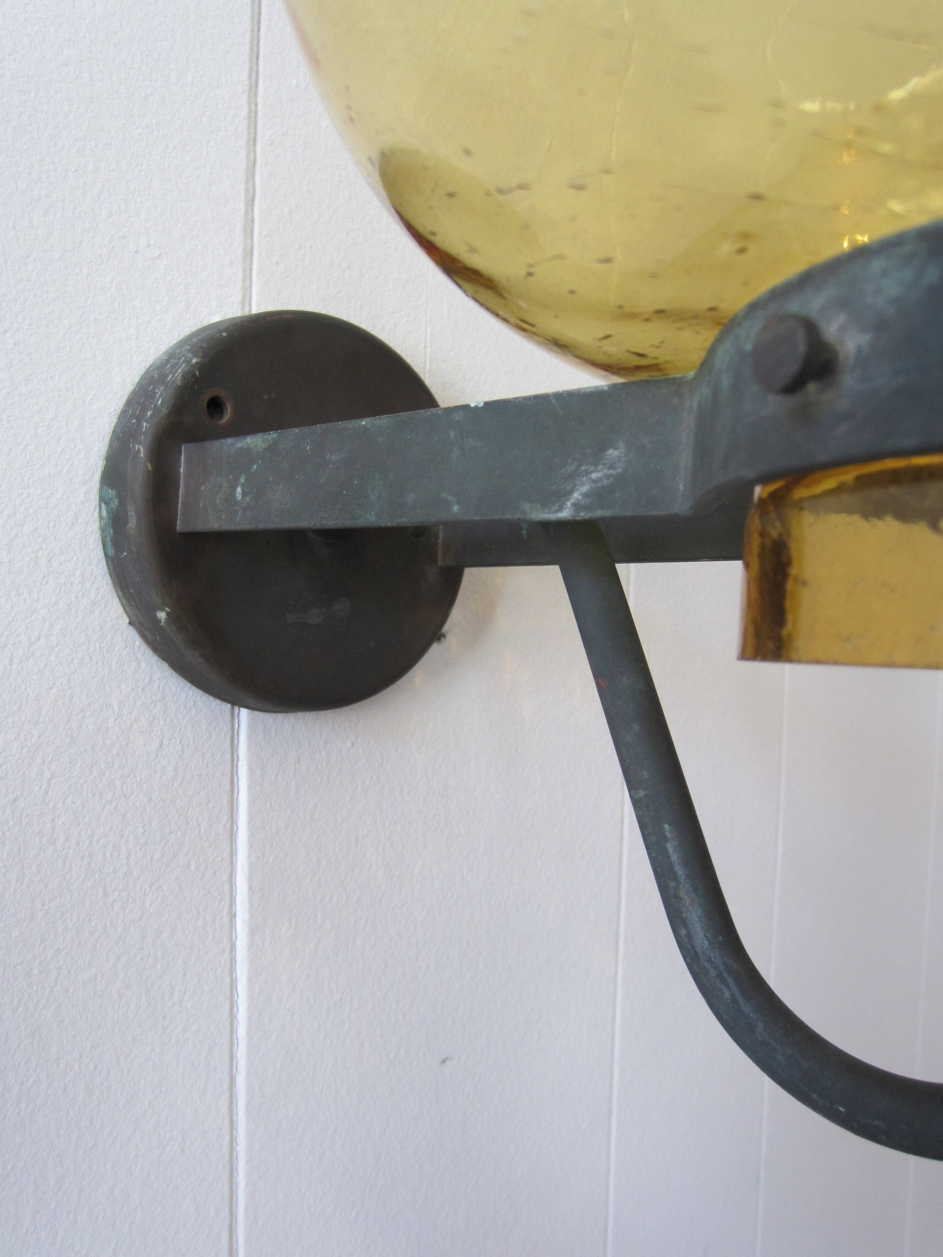 Scandinavian outdoor wall light in copper and amber glass