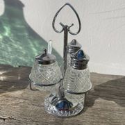 Silver-plated metal and glass salt and pepper shakers