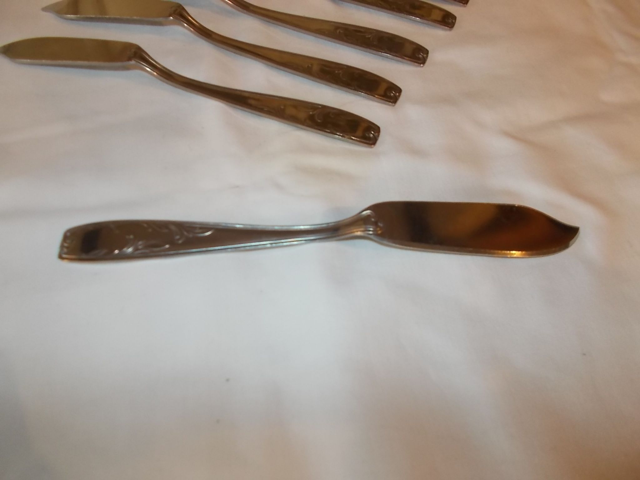 Lot of 12 metal fish cutlery sets.