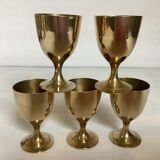 Five brass egg cups
