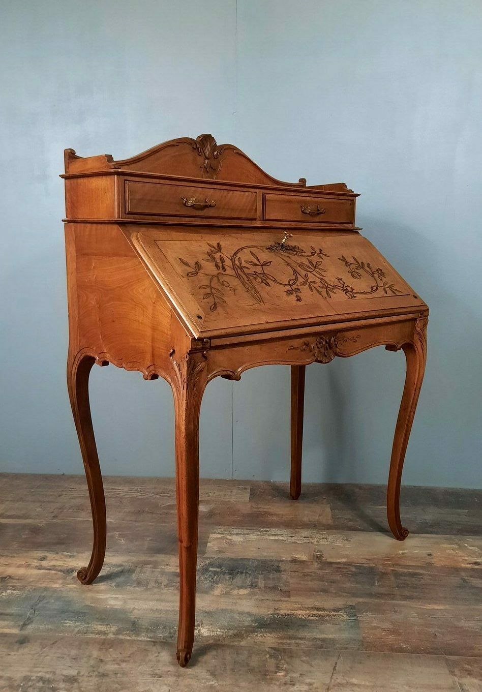Louis XV style stepped donkey back desk in walnut in early 1900
