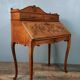 Louis XV style stepped donkey back desk in walnut in early 1900