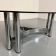 Round coffee table in smoked glass and chrome steel, 1970s design.