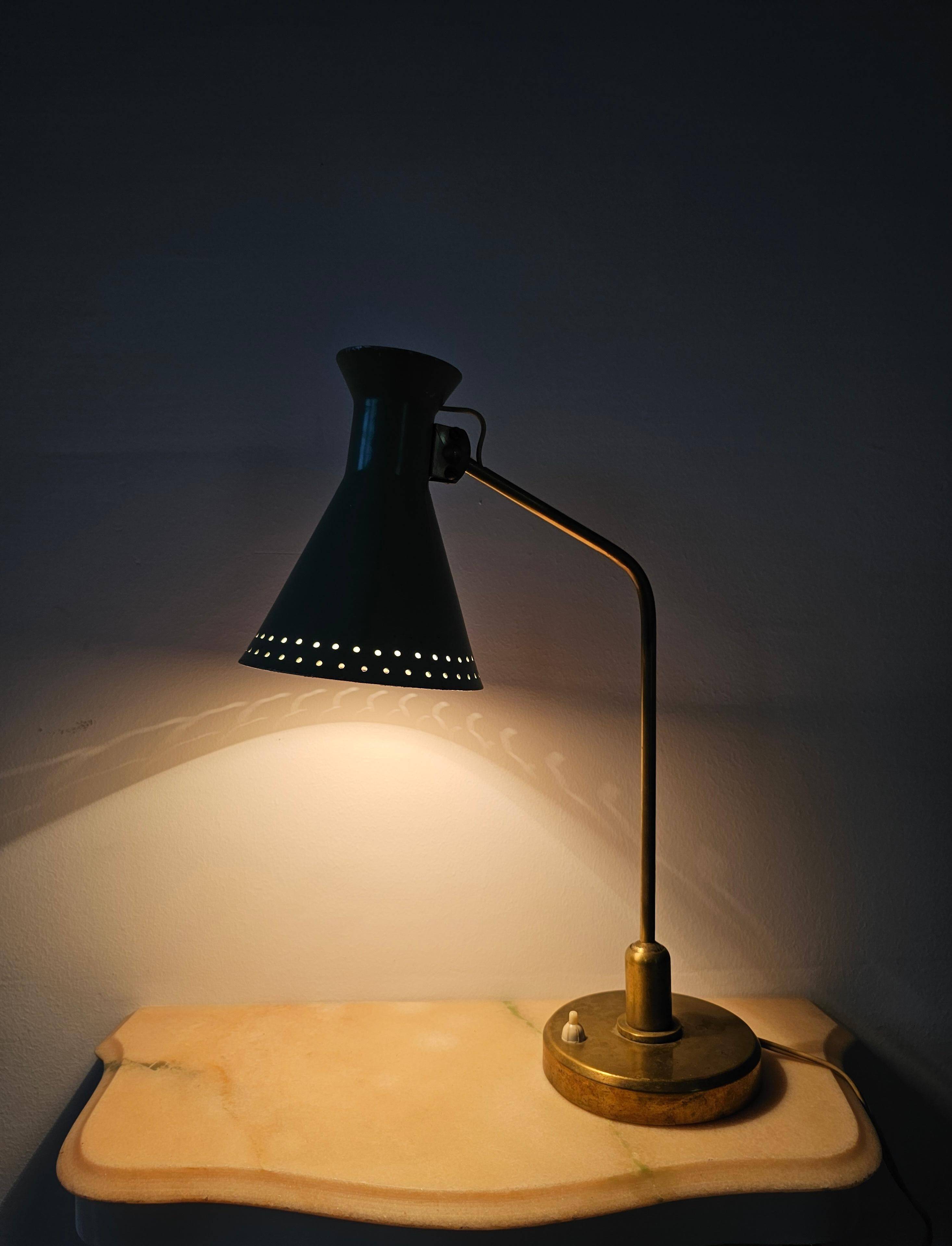 Mid-Century table lamp with a conical metal shade, attributed to Stilnovo.