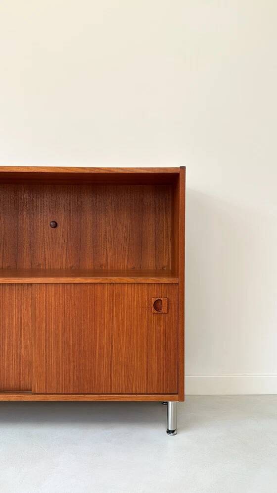Vintage wooden cabinet with sliding doors