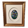Tableau avec en son centre un médaillon en émaux multicolores ovale avec motifs floraux