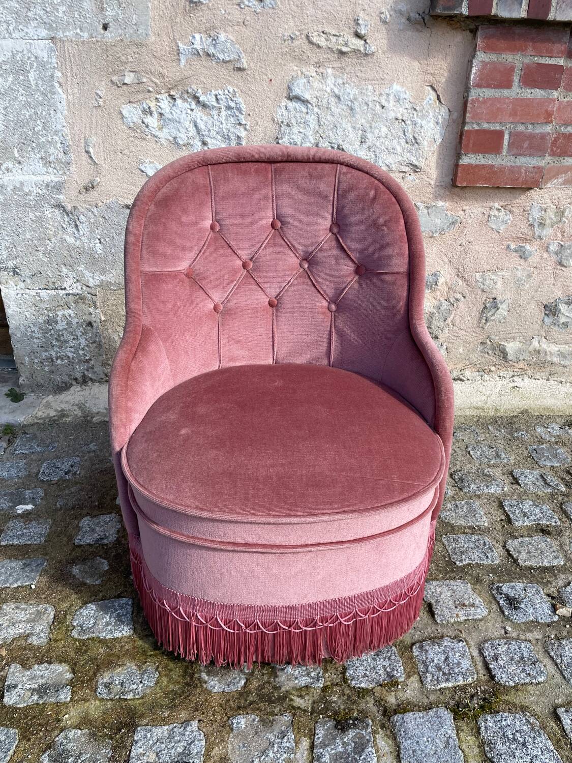 Pink velvet armchair