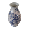 Blue vase adorned with blue and white