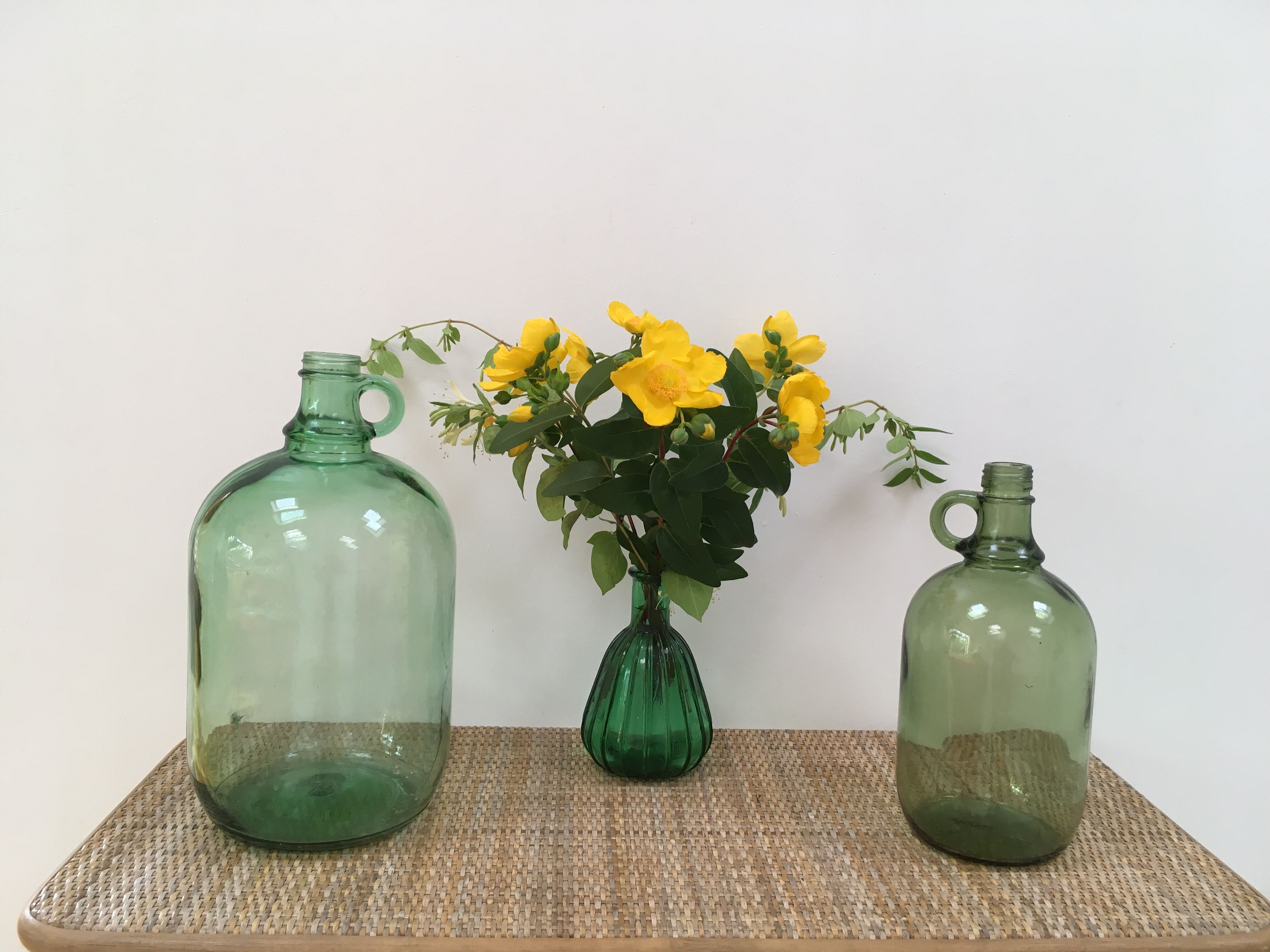 Pair of old demijohn bottles