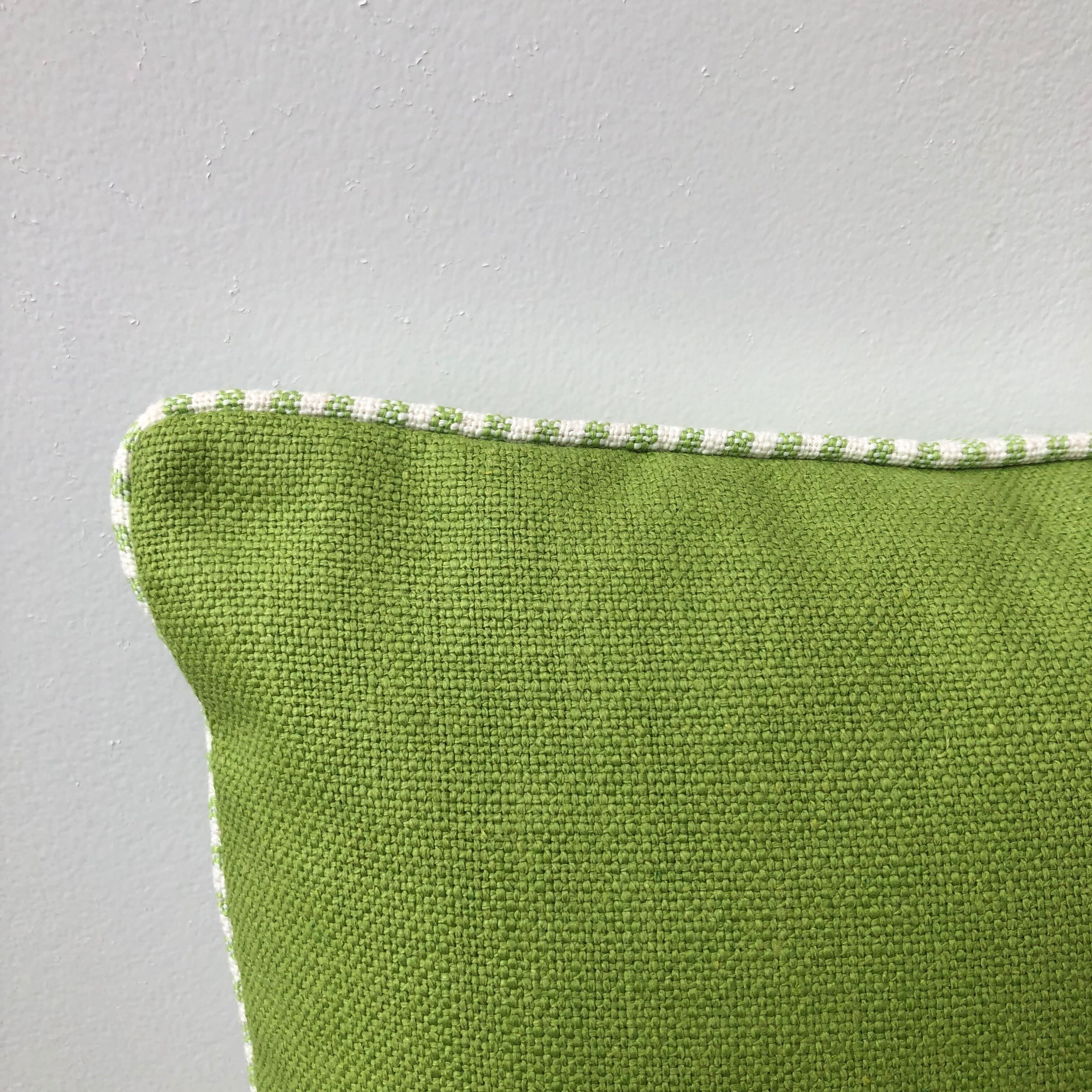 Green and white striped cushion