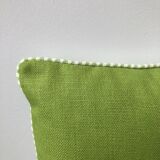 Green and white striped cushion
