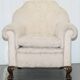 Victorian suite in damask, walnut frame, legs carved in lion's paw.