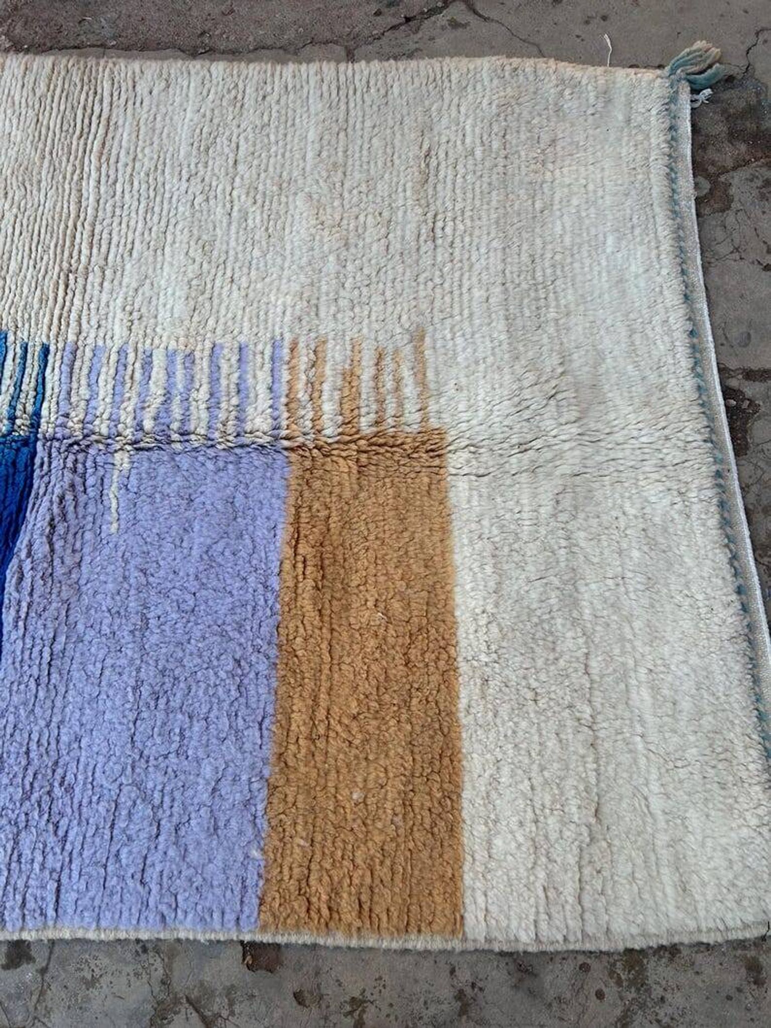 Handmade traditional pure wool rug with colourful patterns.