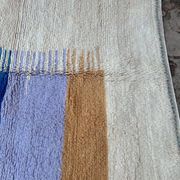 Handmade traditional pure wool rug with colourful patterns.