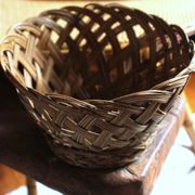 Vintage high round wicker basket with openwork.