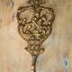 Old brass patère coat rack