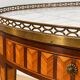 Bouillotte table in Louis XVI style with marquetry, marble, and brass.