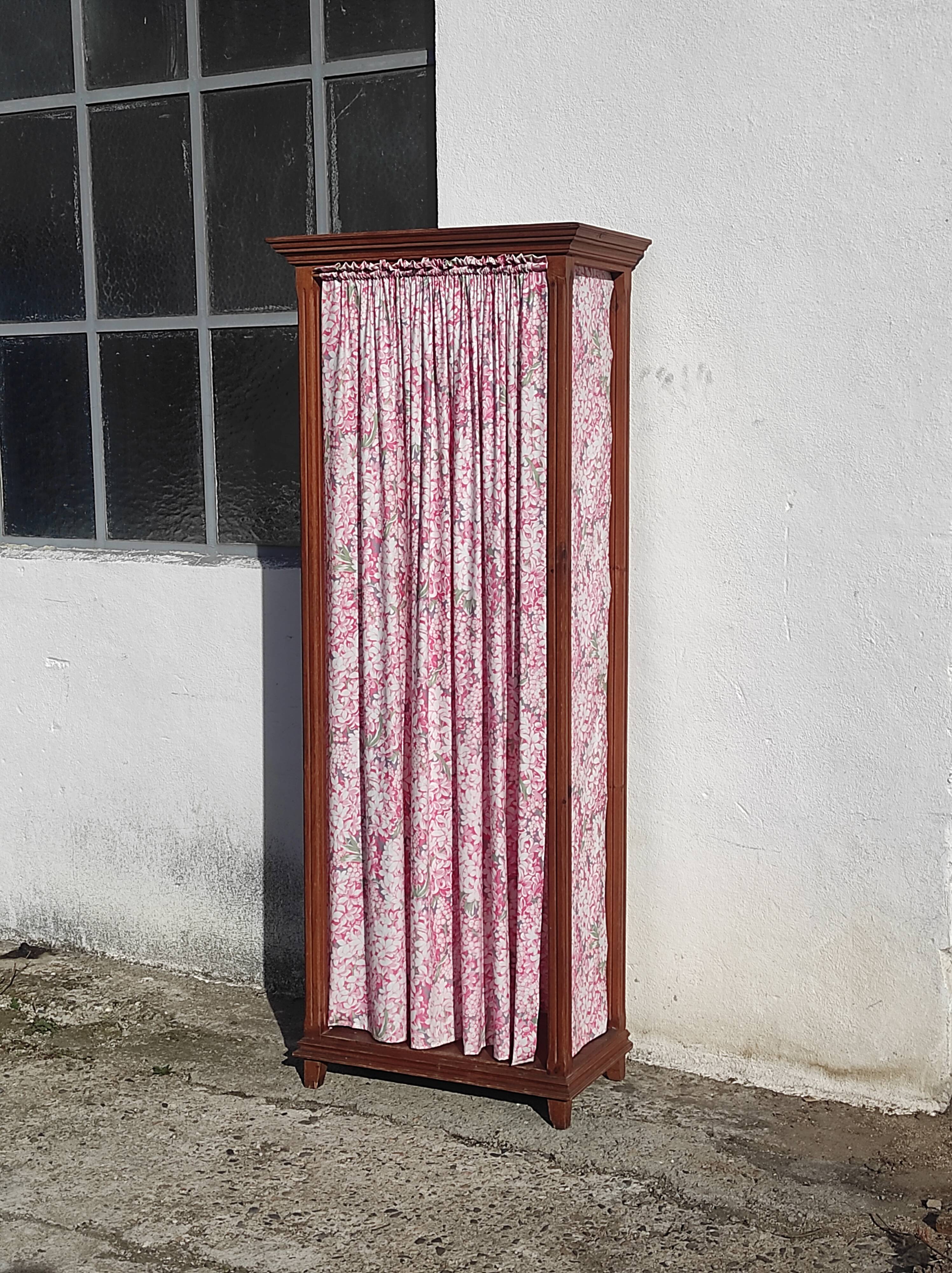 Old wardrobe in old wood and vintage fabric